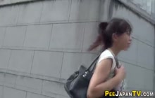 Fetish asian babe pisses in public overpass